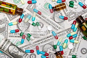 Pharmaceutical and health concept, Antibiotic capsules tablet and brown bottle on dollar background