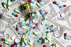 Pharmaceutical and health concept, Variety of antibiotic capsules and pills on dollar background