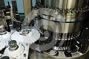 Pharmaceutical industry. Production Line. Machine conveyor with glass bottles, ampoules in a factory. Fill bottles and