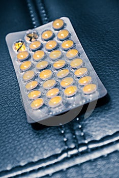 Pharmaceutical industry - yellow pills in a blister