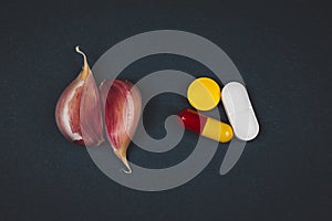 pharmaceutical medicine pills,and garlic - Natural Remedies Vs Pharmaceutical Medicine concept