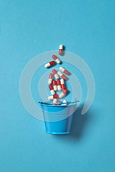 Pharmaceutical pills in the bucket.