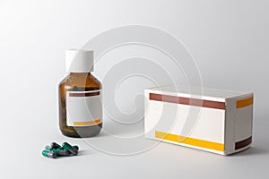 Pharmaceutical product in and out of glass bottle and carton hard gelatine capsule photo