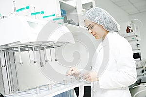 Pharmaceutical researcher making dissolution test