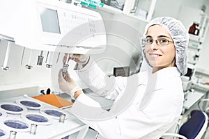 Pharmaceutical researcher making dissolution test