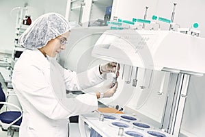 Pharmaceutical researcher making dissolution test photo