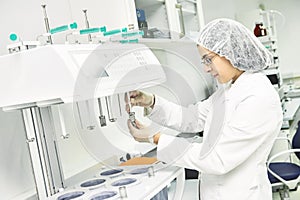 Pharmaceutical researcher making dissolution test photo