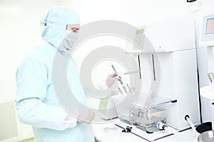 Pharmaceutical researcher working with disintegration tester