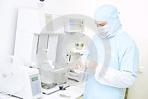 Pharmaceutical researcher working with disintegration tester