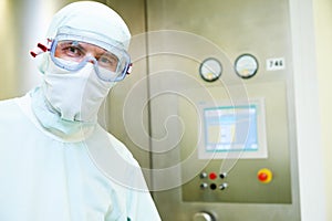 Pharmaceutical worker in protective uniform