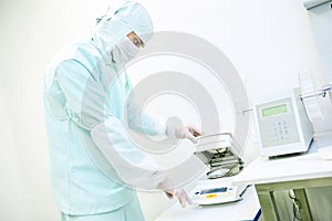 Pharmaceutical worker using moisture analyzer photo