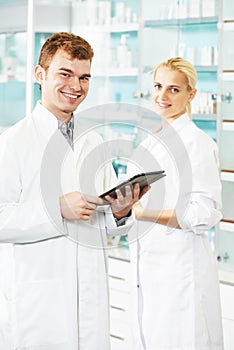 Pharmaceutical workers in drugstore