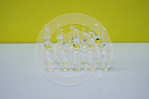 Pharmaceuticals ampoules with bright coloured backgrounds