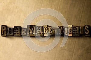 PHARMACEUTICALS - close-up of grungy vintage typeset word on metal backdrop