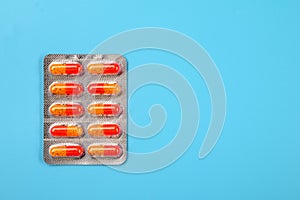 Pharmaceuticals Pills on a blue background. Empty space for text