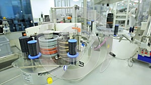 Pharmaceutics. Pharmaceutical worker operates tablet blister packaging machine. manufacture of syringes. syringe