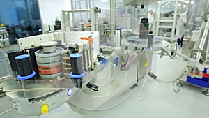 Pharmaceutics. Pharmaceutical worker operates tablet blister packaging machine. manufacture of syringes. syringe