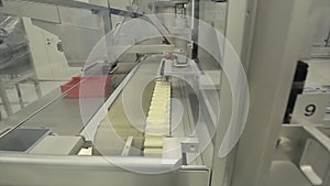 Pharmaceutics. Pharmaceutical worker operates tablet blister packaging machine. manufacture of syringes. syringe
