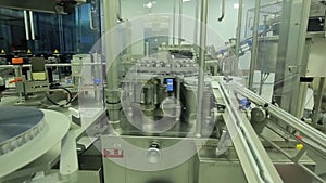 Pharmaceutics. Pharmaceutical worker operates tablet blister packaging machine. manufacture of syringes. syringe