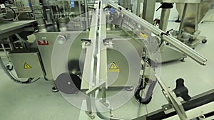 Pharmaceutics. Pharmaceutical worker operates tablet blister packaging machine. manufacture of syringes. syringe