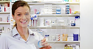 Pharmacist checking a medicine in pharmacy