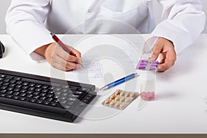 Pharmacist checking prescription