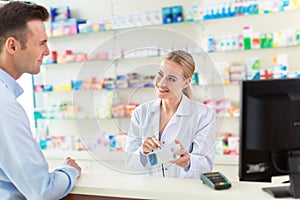 Pharmacist and client at pharmacy