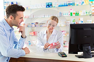 Pharmacist and client at pharmacy