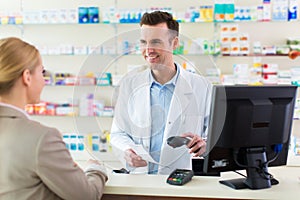 Pharmacist and client at pharmacy