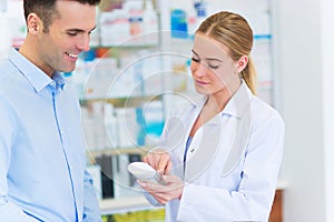 Pharmacist and client at pharmacy