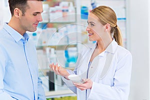 Pharmacist and client at pharmacy