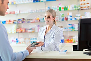 Pharmacist and client at pharmacy