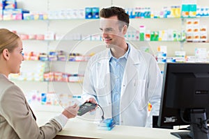 Pharmacist and client at pharmacy