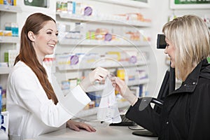 Pharmacist and customer in pharmacy