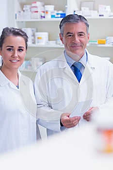 Pharmacist and his trainee looking at the camera