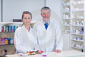 Pharmacist and his trainee looking at the camera