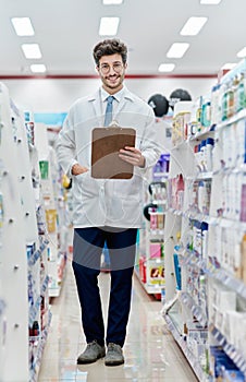 Pharmacist, medicine and portrait of a man with a clipboard in pharmacy store for retail career. Happy male person in