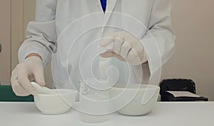 Pharmacist performing a quality control of effervescent tablets