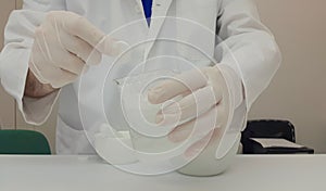 Pharmacist performing a quality control of effervescent tablets