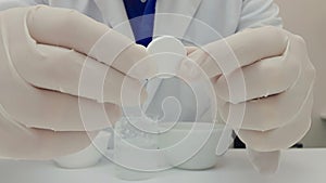 Pharmacist performing a quality control of effervescent tablets