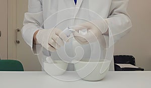 Pharmacist performing a quality control of effervescent tablets