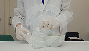 Pharmacist performing a quality control of effervescent tablets