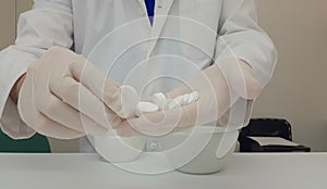 Pharmacist performing a quality control of effervescent tablets