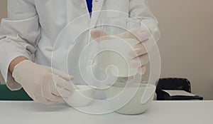 Pharmacist performing a quality control of effervescent tablets