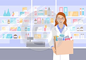 Pharmacist in pharmacy holds bag with medicines