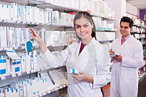 Pharmacist and pharmacy technician posing