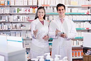 Pharmacist and pharmacy technician working photo