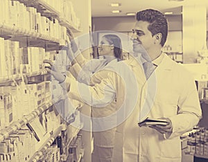 Pharmacist posing in drugstore