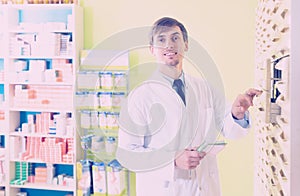 Pharmacist posing in pharmacy depot