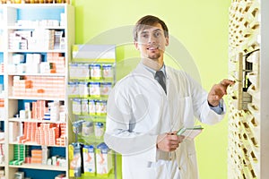 Pharmacist posing in pharmacy depot
